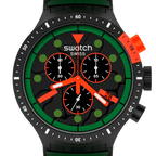 A close-up of a Swatch Swiss analog watch with a black case and dial, featuring a bold green bezel ring, bright orange accents on the crown, pushers, and hands, and green hour markers.