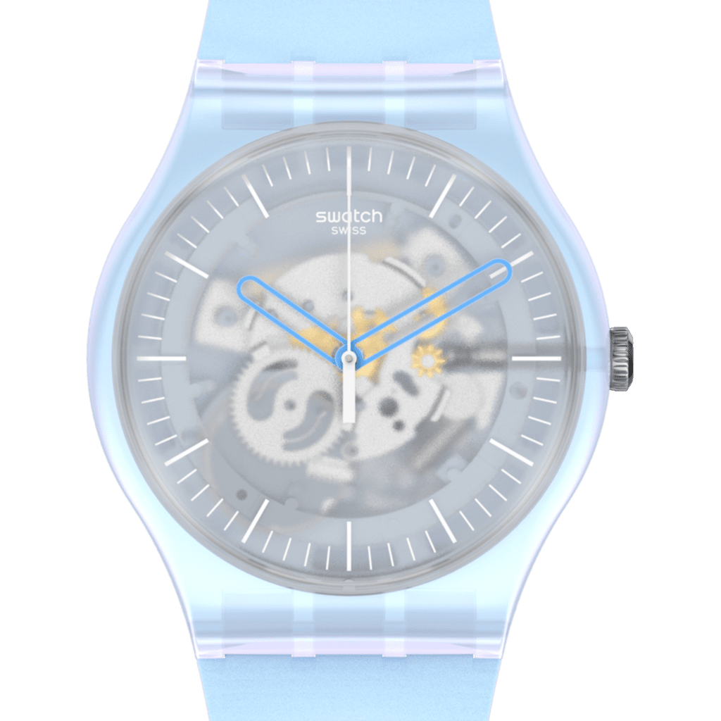 Swatch Swiss automatic watch with a translucent light blue resin case and strap, featuring a skeleton dial with visible gears and blue hands, set against a solid green background.